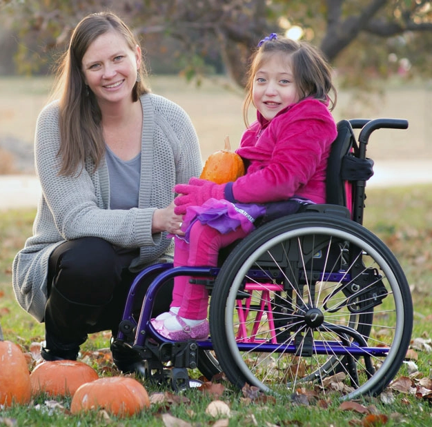 Colorful pediatric manual wheelchair sized for a child